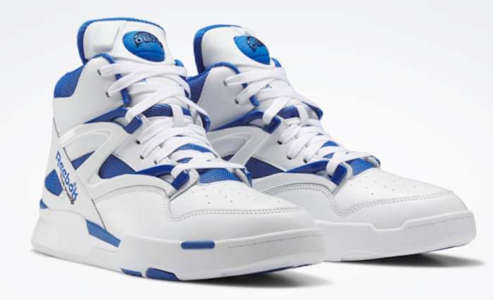 View of white and blue Reebok shoes.